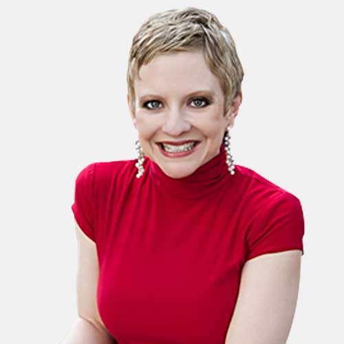 smiling woman with blonde hair wearing red shirt and earrings